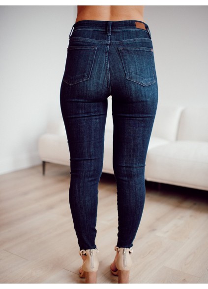 Dark blue high waisted metal button skinny jeans