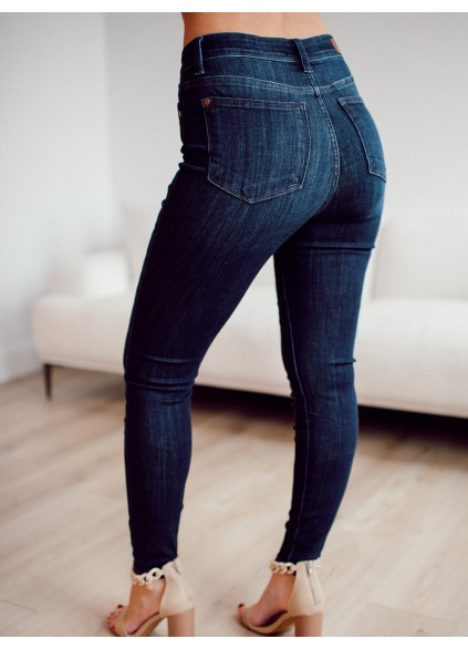 Dark blue high waisted metal button skinny jeans