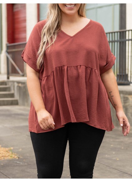 V-neck short sleeved shirt with ruffle hem